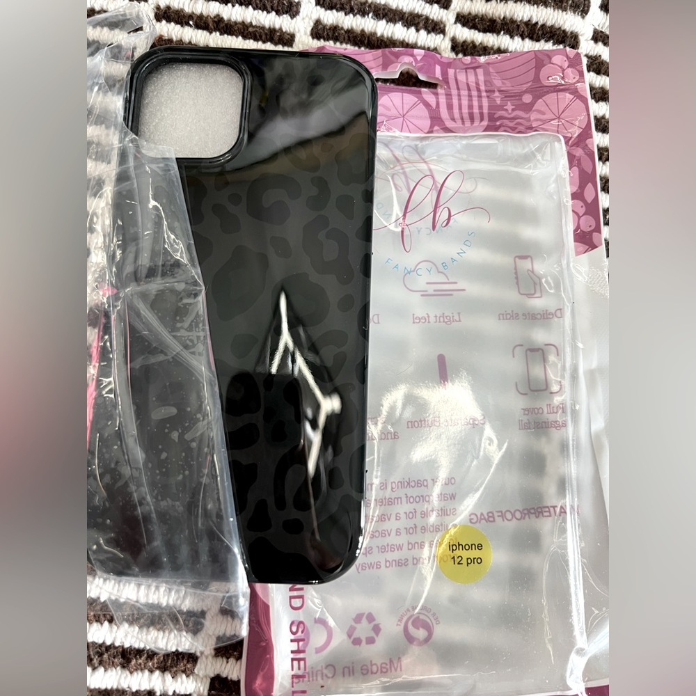 Fancy Bands Phone case.  For I-Phone 12.  Brand new, Never used!  Black Leopard